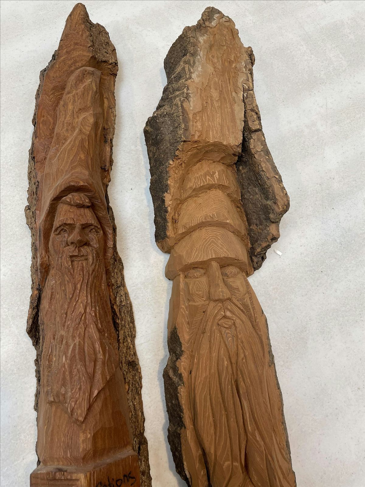 Carving faces in cottonwood bark.